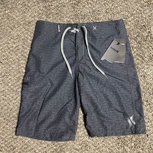 Men’s Hurley board shorts. Swimming trunks. Men’s physique competition shorts.
